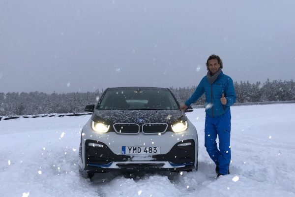 Man posing with a BMW i3 GR