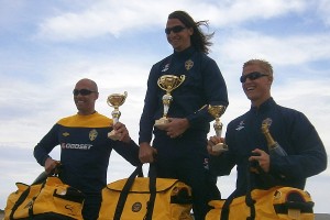 Car race winners with their trophies